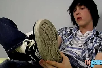 Young emo Tyler Bolt jacks off his cock and licks his toes
